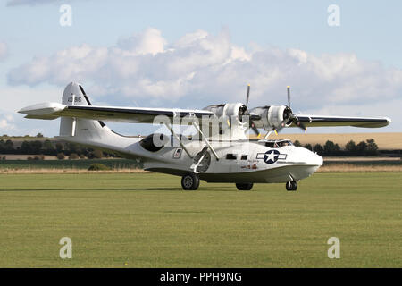 Plane Sailings former Canadian built Canso marked as a USAAF Catalina taxiing in at Duxford airfield following it's display. Stock Photo