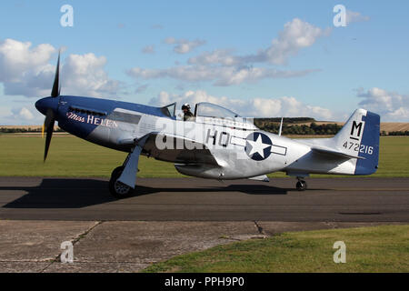 'Miss Helen', a historic preserved P-51D Mustang taxing in at the Imperial War Museum at Duxford, Cambridgeshire following a air display. Stock Photo