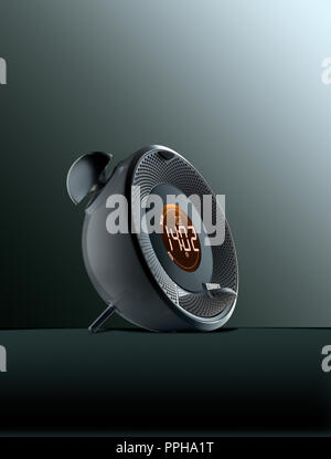 Modern Alarm Clock with Orange Digital  Display. Bells, Plug to connect  smartphone Stock Photo