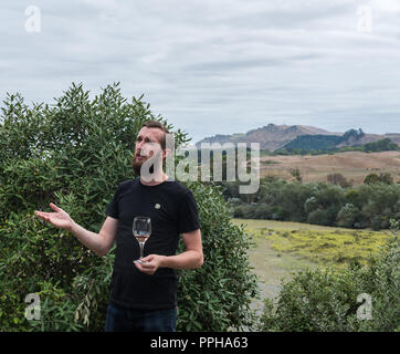 Hawke's Bay, New Zealand--February 27, 2018. A sommelier from Abbey Cellars vineyard in Hawke's Bay explains the finer points of wine tasting Stock Photo