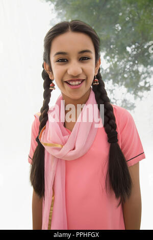 Portrait of a smiling village girl. Stock Photo