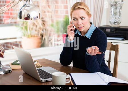 Businesswoman talking on cellphone Stock Photo