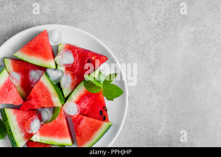 Juicy watermelon slice popsicles on bright background, overhead Stock Photo