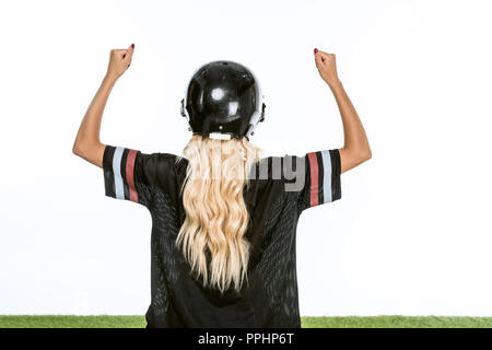 rear view of female american football referee giving signals to professional  players during match on the stadium field Stock Photo - Alamy