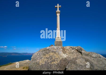 Cross in finisterre end of Saint James Way in Spain Camino de Santiago Stock Photo