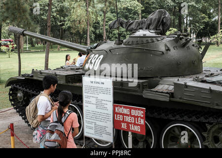 People looking at an M48 Patton tank at the War Remnants Museum in Ho Chi Minh City, Vietnam Stock Photo