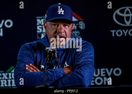 LA Dodgers Manager Dave Roberts listens as US President Donald J. Trump