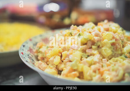 Traditional russian Olivier salad on New Year's Eve. Stock Photo