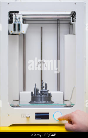 White 3D printer during work. Plastic castle - disney figure almoust done Stock Photo