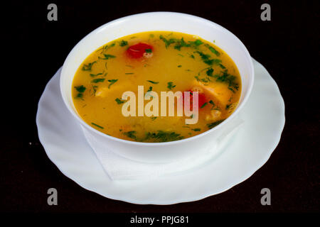 Fish soup with salmon and tomato - Uha Stock Photo