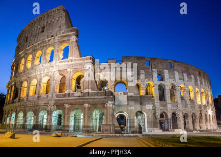 Famous Colosseum under the night sky in Rome Stock Photo