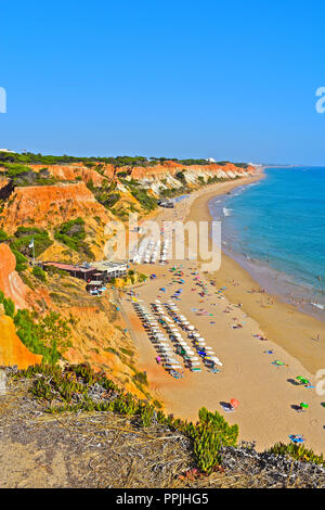 The wonderful golden sandy beach at Praia de Falésia stretches than six kilometres from Vilamoura to Olhos d'Agua, in the Algarve region of Portugal. Stock Photo