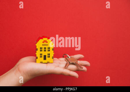 the symbol of the house and the keys in the palm of your hand. Stock Photo