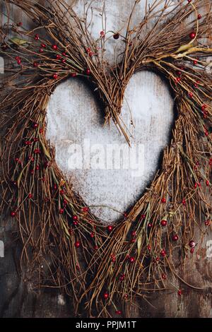 Holiday Love Wreath PhotoA heart-shaped holiday wreath with small berries. Stock Photo