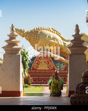 tourists posing in front of temple in koh samui thailand shot with selective focus and lens flare Stock Photo
