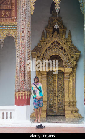 tourists posing in front of temple in koh samui thailand shot with selective focus and lens flare Stock Photo