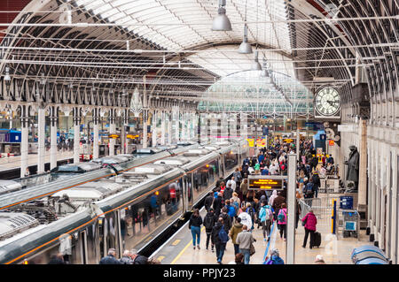 Passengers on platform of Paddington Railway Station, London, UK Stock Photo