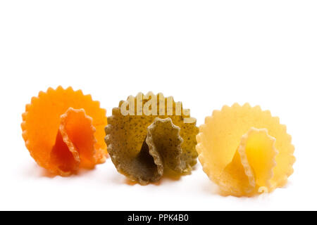 Pasta (in form of mashrooms) of three colors isolated on white background Stock Photo