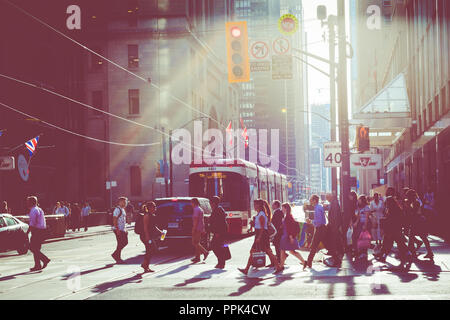 TORONTO, CANADA - SEPTEMBER 17, 2018: Rush hour atToronto's busiest intersections. Financial district at the background. Stock Photo