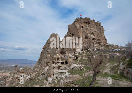 Uchisar Castle in Cappadocia Turkey, blue and cloudy sky in  Spring. Stock Photo