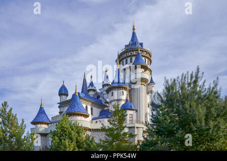 Close up view of fairytale castle in park on cloudy background. Stock Photo