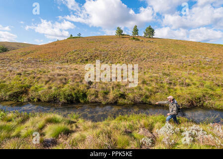 A man fly fishing in a float tube on Dougan Lake near Cobble Hill