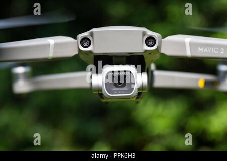 Close up view of Mavic 2 pro front camera, the drone is hovering on air Stock Photo