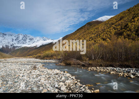 Autumn landscape with a mountain river Enguri. View to the peak of Shkhara. Main Caucasian ridge. Samegrelo-zemo svaneti, Georgia Stock Photo