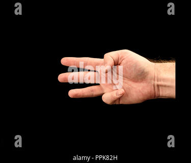 Male hand shows score or number three isolated on black background Stock Photo