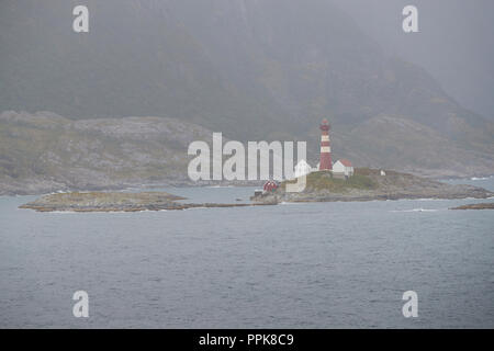 The Norwegian Landegode Lighthouse (Landegode Fyr), located on the small island of Eggløysa, About 100 Km North Of The Arctic Circle. Norway. Stock Photo