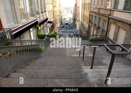 long staircase in the middle of the houses downhill in a hill town Stock Photo