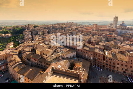 Siena Italy skyline, looking from the Torre del Magnia to Sienna Cathedral, the medieval city of  Siena, Tuscany Italy Stock Photo