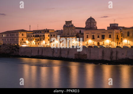 Chiesa dello Spirito Santo and Ortigia waterfront at sunset, Siracuse, Sicily, Italy. Stock Photo