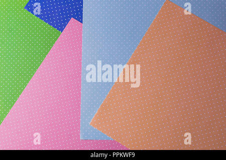 Multi colored abstract paper of pastel colors with geometric shape flat lay, minimalism style. Stock Photo
