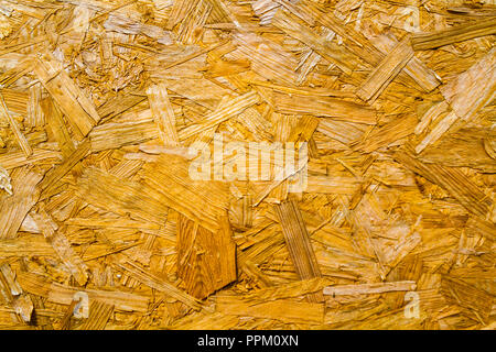Recycled compressed wood chipboard as texture and background Stock Photo
