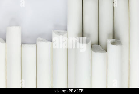 Pieces of chalk on a white background , geometric and simple composition ,top view ,abstract effect Stock Photo