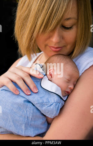 Vertical portrait of a premature baby with a proud mum. Stock Photo