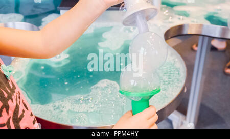 Kids science with bubbles at local science museum. Stock Photo