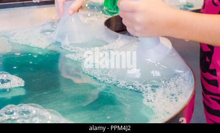 Kids science with bubbles at local science museum. Stock Photo