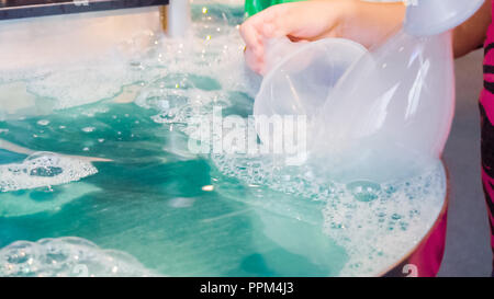 Kids science with bubbles at local science museum. Stock Photo