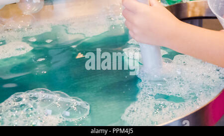 Kids science with bubbles at local science museum. Stock Photo