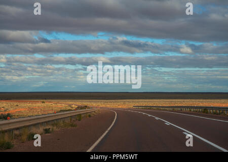 Empty road leading through the australian bush, outback, South Australia Stock Photo