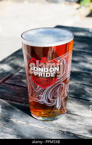 A pint of Fullers London Pride beer.  The brewers web site describes it as a 'tawny-coloured premium ale' with a strength of 4.1% ABV. Stock Photo