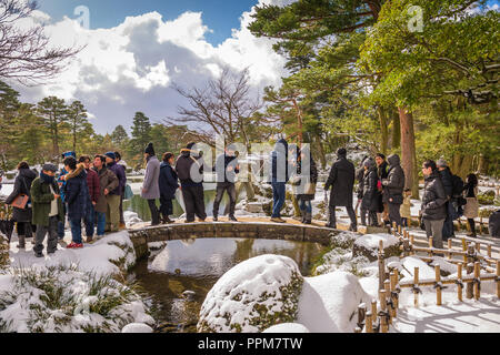 KANAZAWA, JAPAN - JANUARY 14, 2017: Tourists at Kenrokuen Gardens during the winter season. Stock Photo