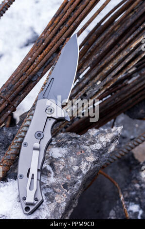 Knife with aggressive design. Vertical shot of the knife. Stock Photo