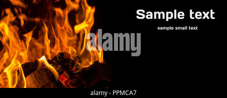 Burning firewood in flames of the fireplace wide postcard Stock Photo