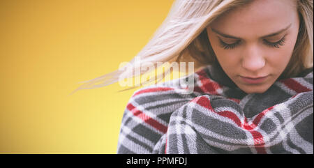 Composite image of close up of a woman wraped in a blanket Stock Photo