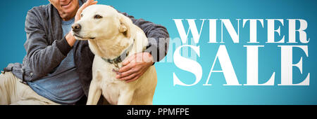 Composite image of smiling old man sitting stroking his pet dog Stock Photo