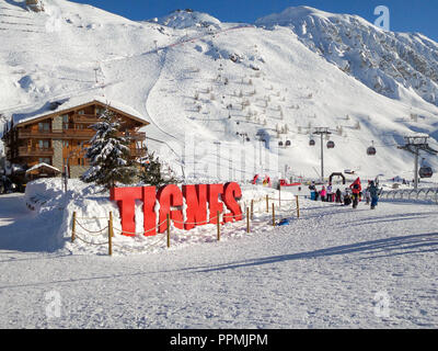 Ski station of Tignes in winter, letters Tignes Stock Photo