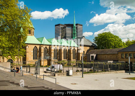 Cathedral in Essen and modern business tower, city skyline Stock Photo